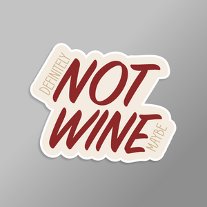Sticker with 'Definitely Not Wine Maybe' text on a gray background