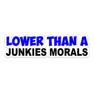 Vinyl car bumper sticker with the text 'LOWER THAN A JUNKIES MORALS' in blue and black lettering on a white background.