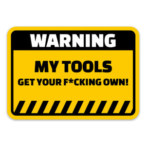 A yellow sticker with black and white text that reads: WARNING MY TOOLS GET YOUR F*CKING OWN