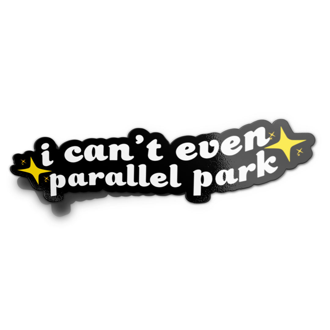 Mockup of a black vinyl sticker with white text saying 'i can't even parallel park' with a yellow star cluster on each end.