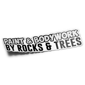A black vinyl sticker with white text saying 'PAINT & BODYWORK BY ROCKS & TREES'.