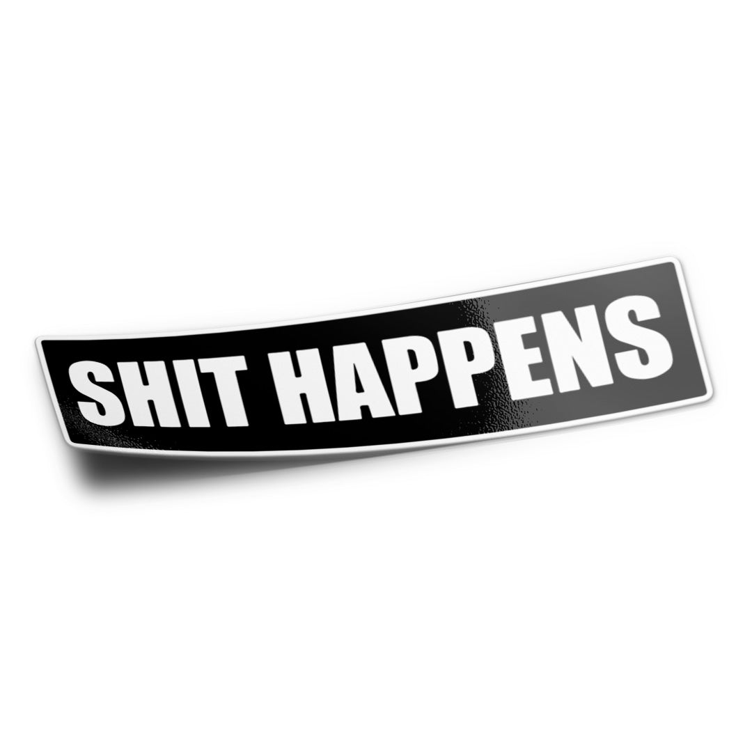 A black vinyl sticker with the phrase 'SHIT HAPPENS' printed in white block letters.