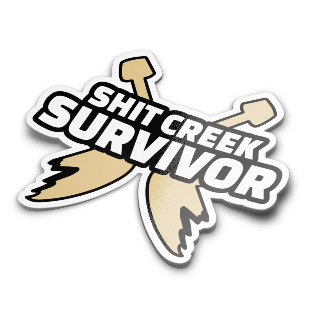 A sticker with a humorous text 'Sh*t Creek Survivor' designed in a bold typography, predominantly in beige and black colours, with background images of broken oars.