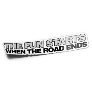 A sticker with the text 'THE FUN STARTS WHEN THE ROAD ENDS' in a bold, black font against a white background.