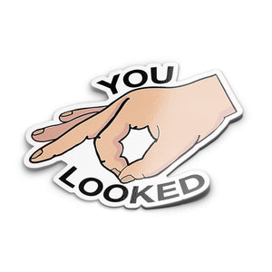 A sticker with an illustration of a hand making a 'you looked' gesture with fingers.