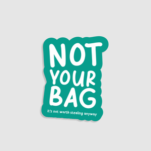 Sticker with 'Not Your Bag' text on a teal background. Designed to go on suitcases.