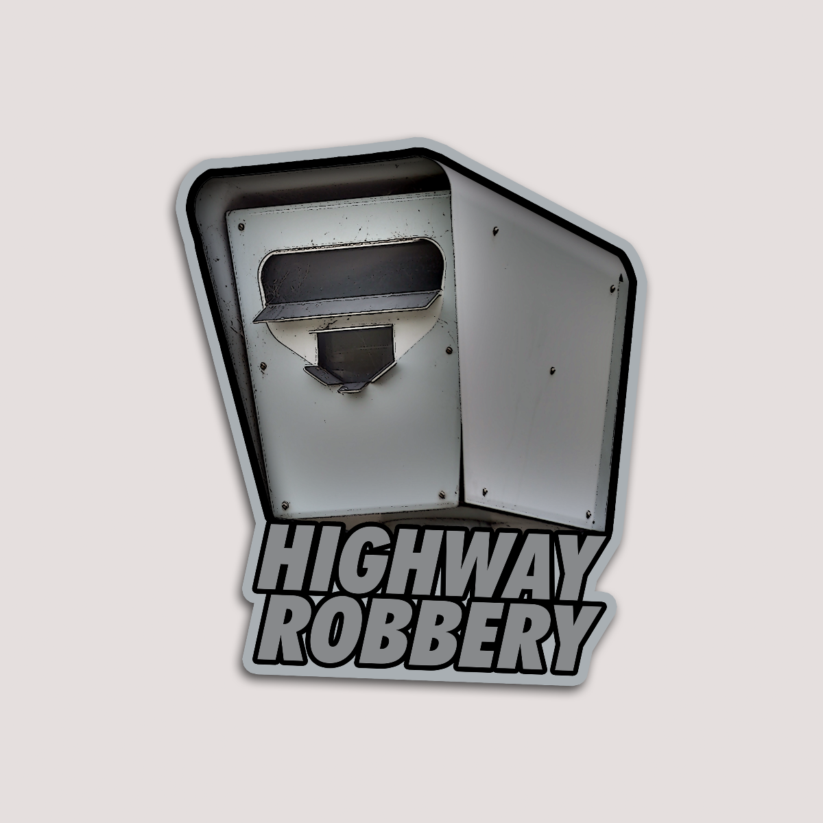A sticker with a photo of a permanent speed camera featuring the text 'HIGHWAY ROBBERY' in bold, gray letters.