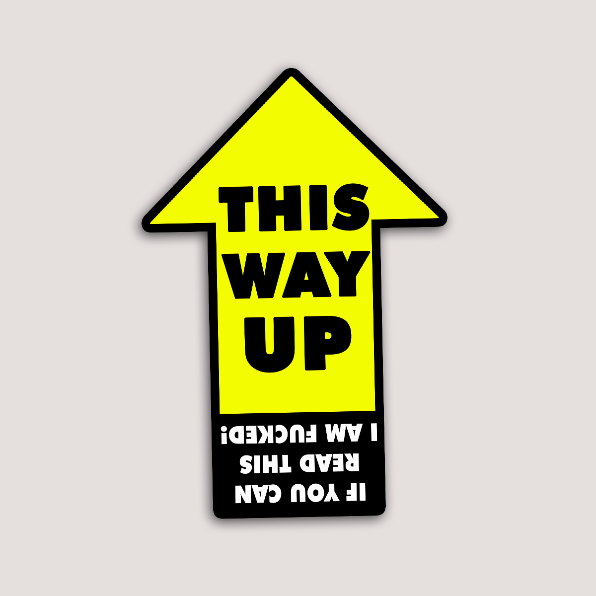 A yellow vinyl sticker with black text and arrow graphic, humorously stating 'THIS WAY UP' and text underneath that is upside down saying 'if you can read this i am f*cked'.