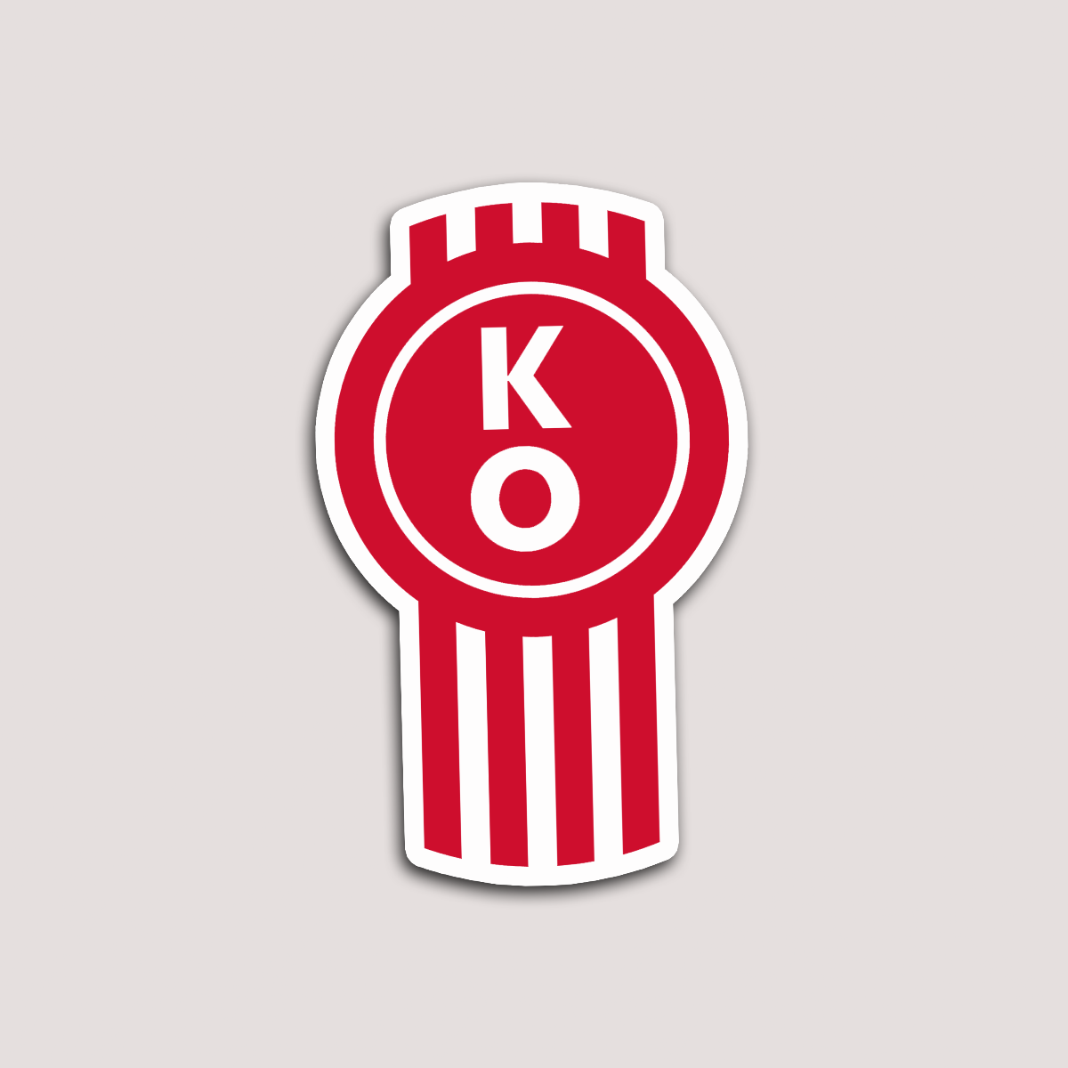 A sticker with a red and white design featuring the letters 'KO' in the center